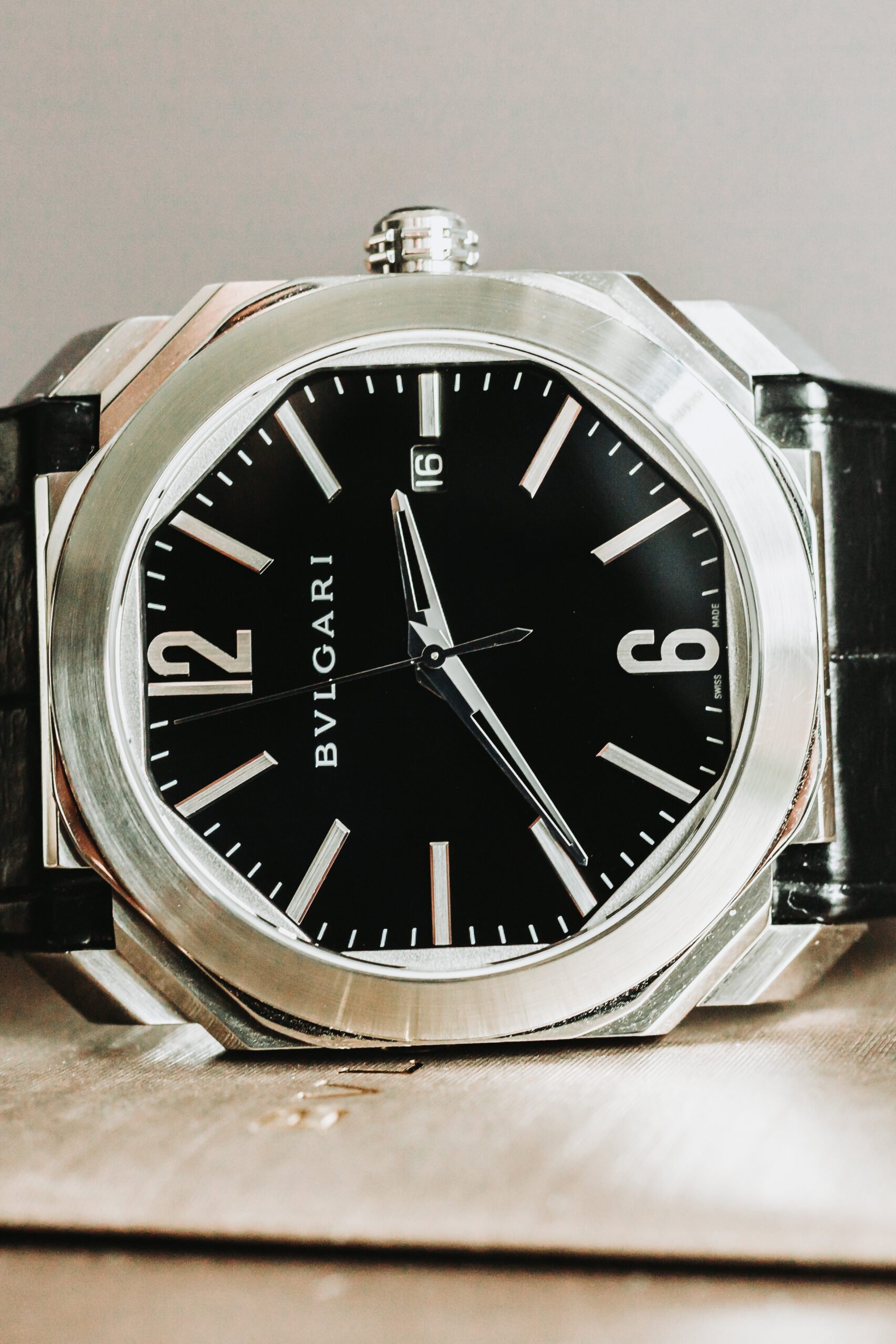 Elegant black octagonal watch design.